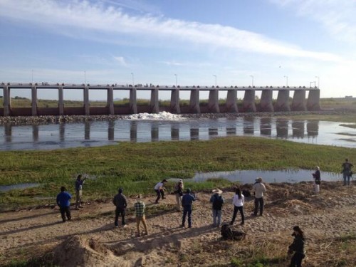 People gather to watch the "pulse flow" of Colorado River water from the Morelos Dam.