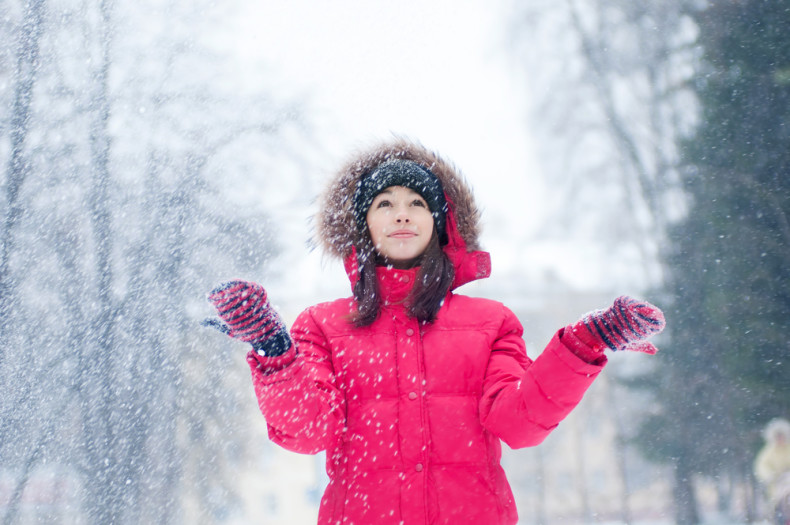 A model enjoys the snow.