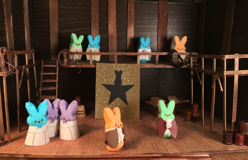 The cast of Hamilpeep stands on their diorama stage.