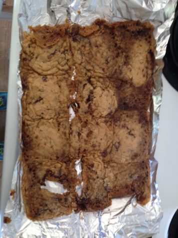 A pan full of cookies that all melted together into one big soupy blob.