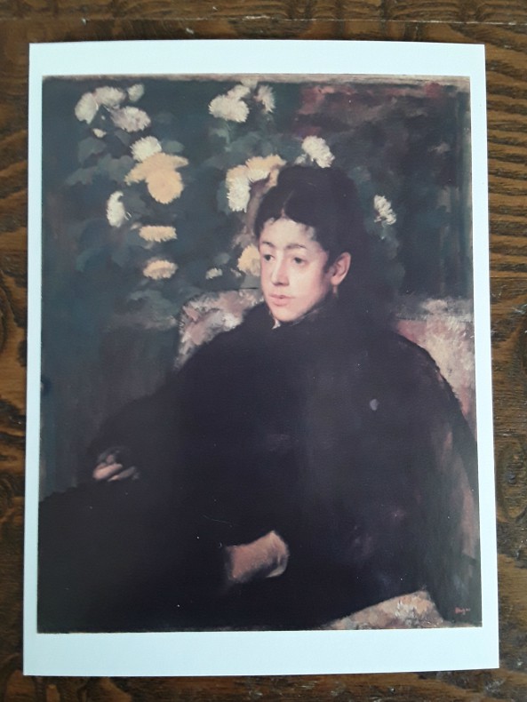 postcard of a woman in black