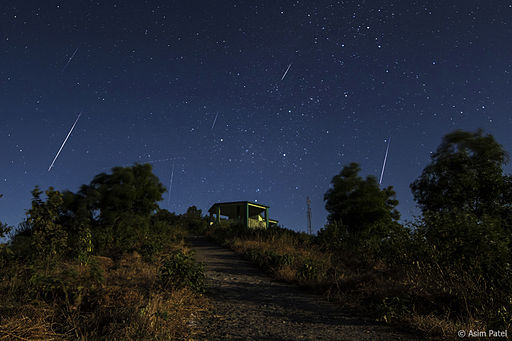 Many meteors on a blue sky