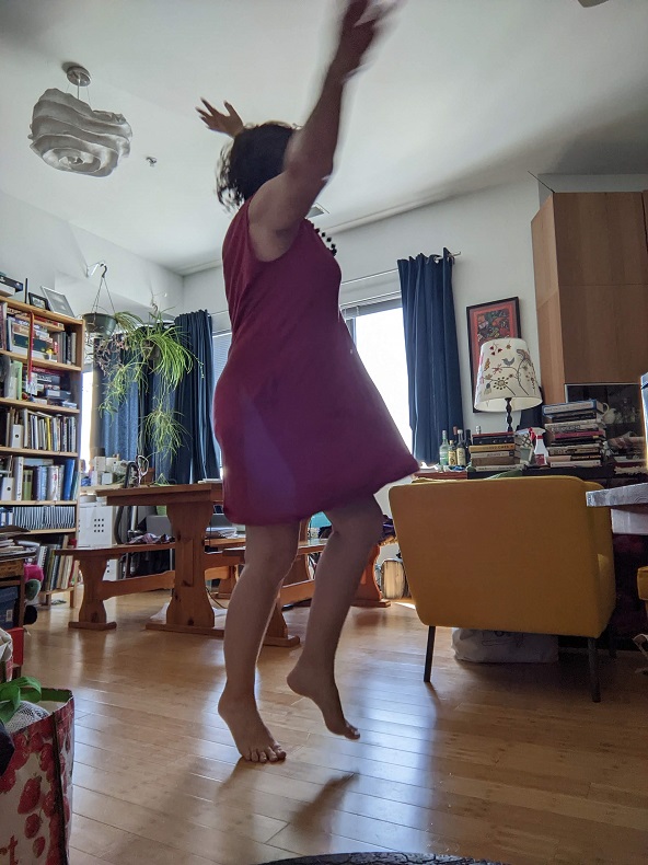 woman dancing in pink dress