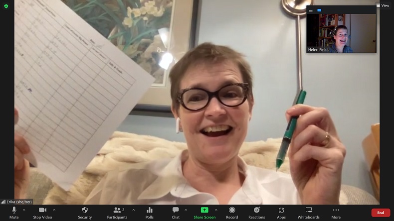 screenshot of a woman named Erika holding a green pen on zoom 